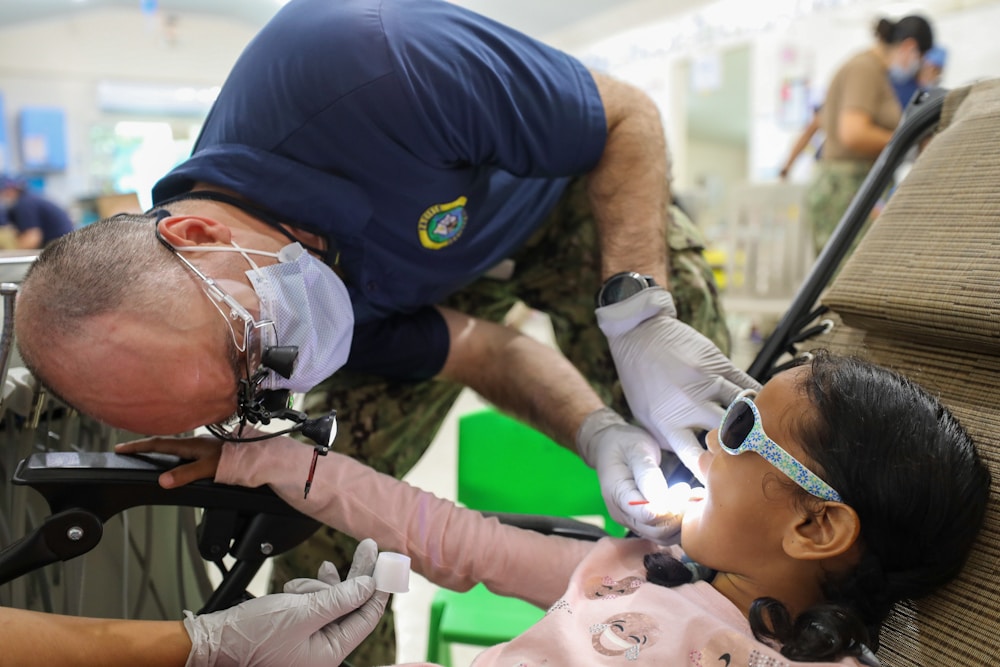 A young girl during a gentle dental check-up.